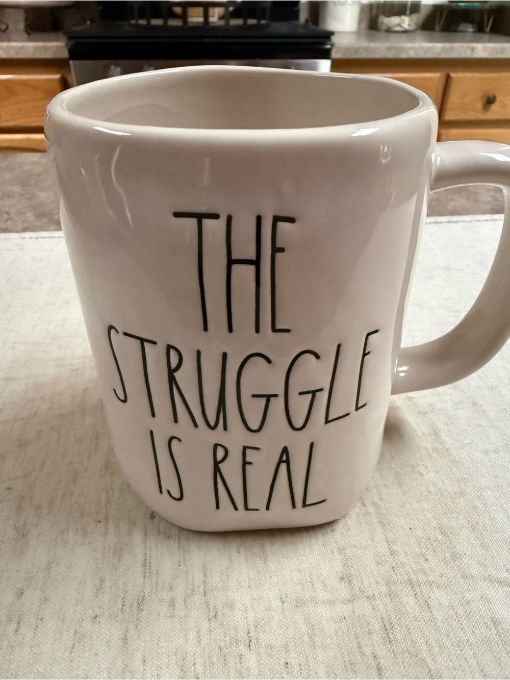 Rae Dunn White Ceramic Mug with "The Struggle Is Real" Text